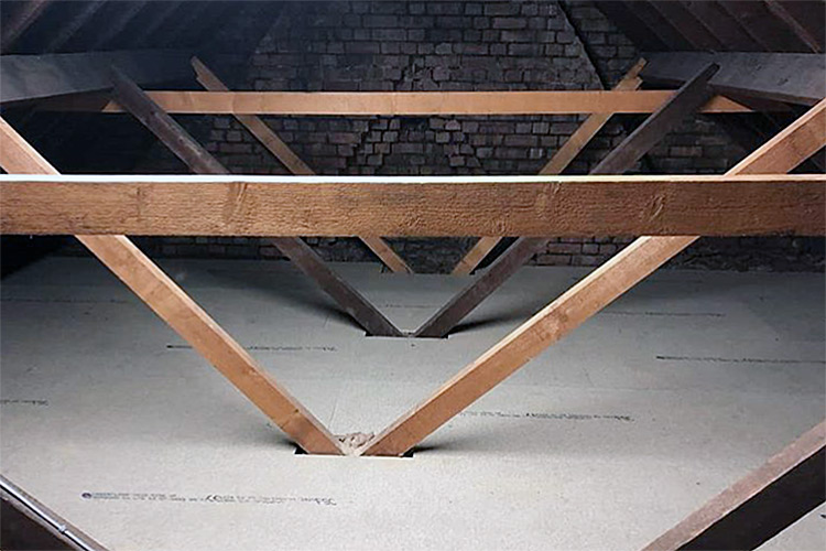 Loft flooring with wooden support beams