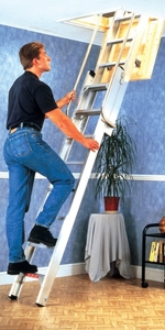 Person climbing up an aluminium loft ladder